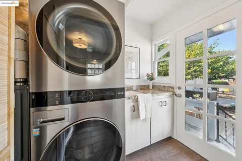 a bedroom with a bed and painting on the wall