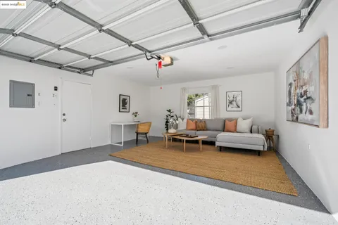 a view of a patio with table and chairs and potted plants