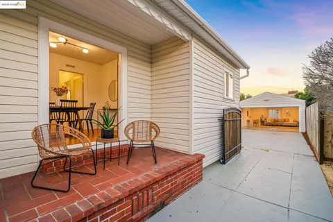a view of a chairs and table in the patio