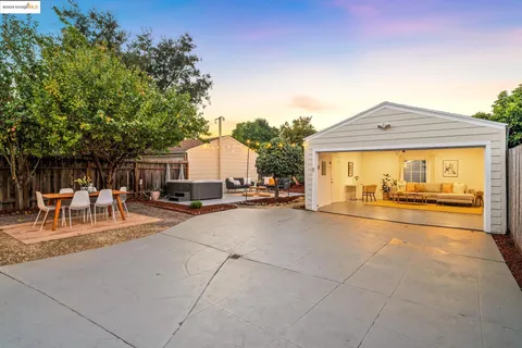 a view of a backyard with sitting area