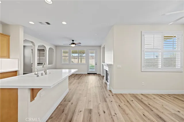 a spacious bathroom with a granite countertop sink mirror and a bath tub
