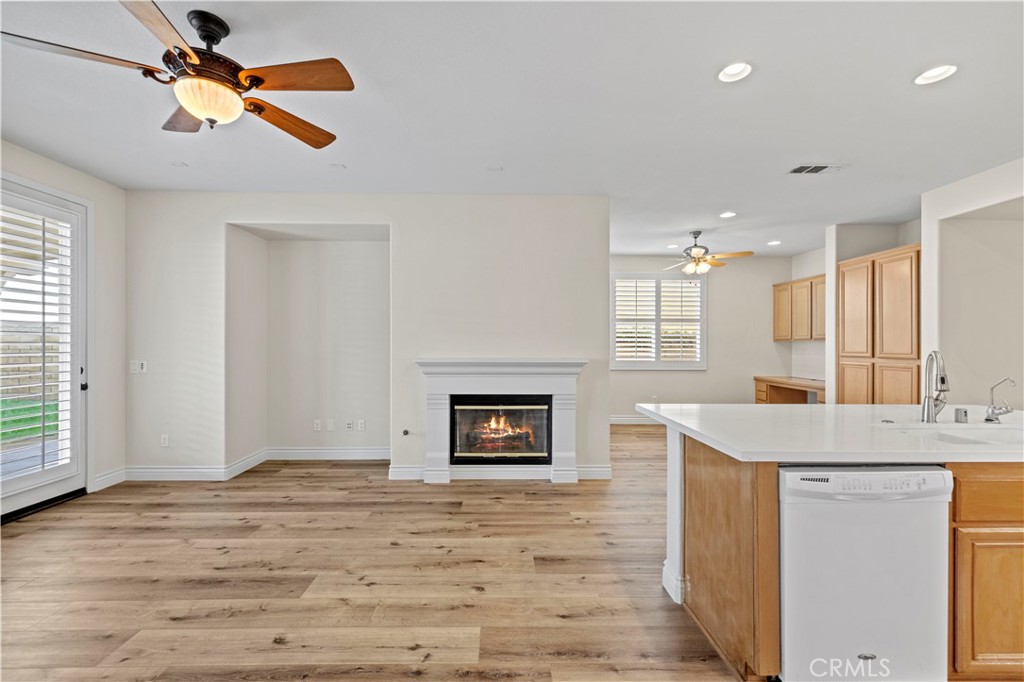 28355 Stansfield Lane Saugus, CA 91350 - Photo 14 of 52 a view of a kitchen and a sink cabinet a fireplace wooden floor and cabinet