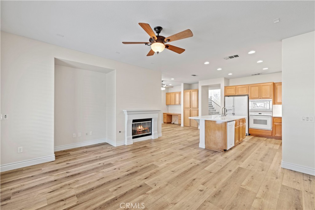28355 Stansfield Lane Saugus, CA 91350 - Photo 15 of 52 a view of a kitchen with a sink and a fireplace