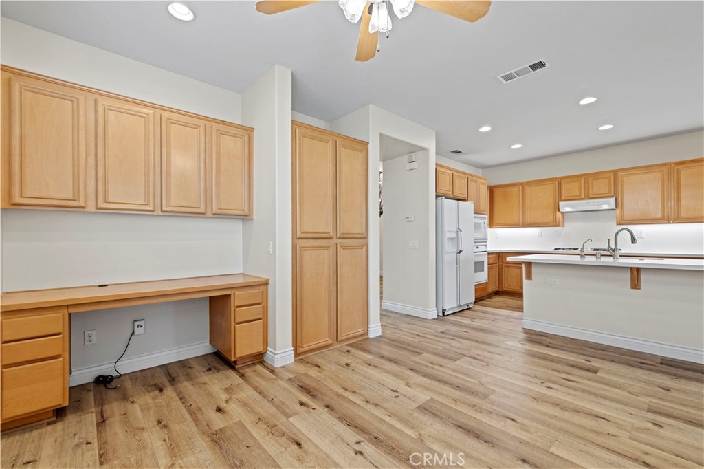 28355 Stansfield Lane Saugus, CA 91350 - Photo 18 of 52 a kitchen with stainless steel appliances granite countertop a refrigerator and a sink