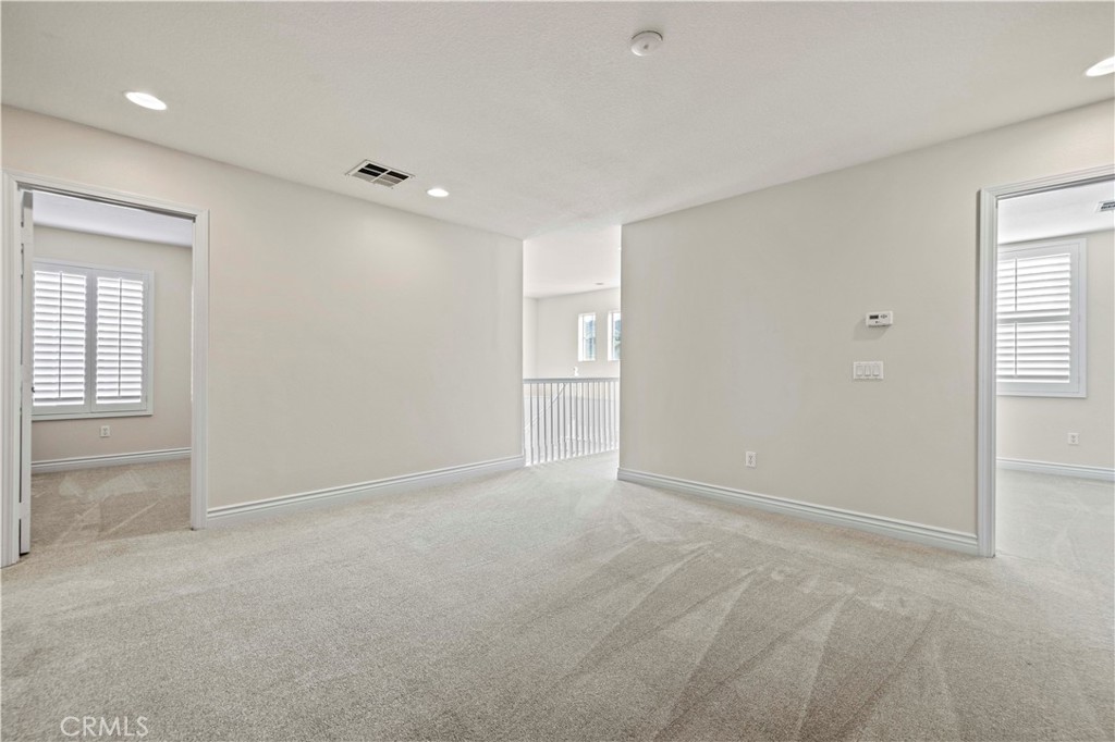 28355 Stansfield Lane Saugus, CA 91350 - Photo 29 of 52 an empty room with windows and closet
