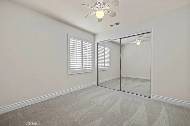 a spacious bathroom with a double vanity sink a mirror and a bathtub