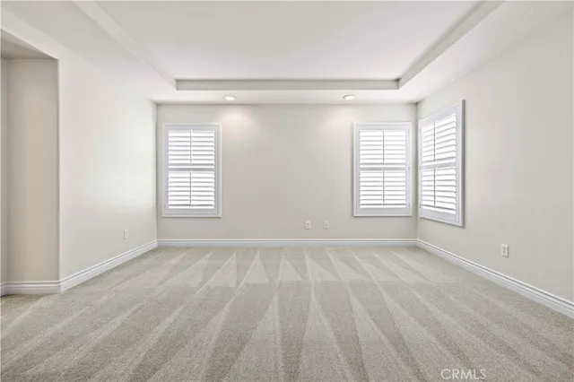 a view of an empty room and closet area