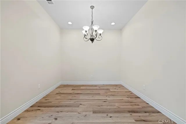a view of a chandelier in an empty room