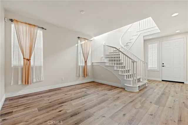 a view of entryway with wooden floor