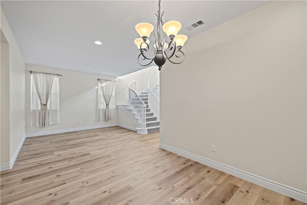 28355 Stansfield Lane Saugus, CA 91350 - Photo 9 of 52 a view of a room with wooden floor and chandelier