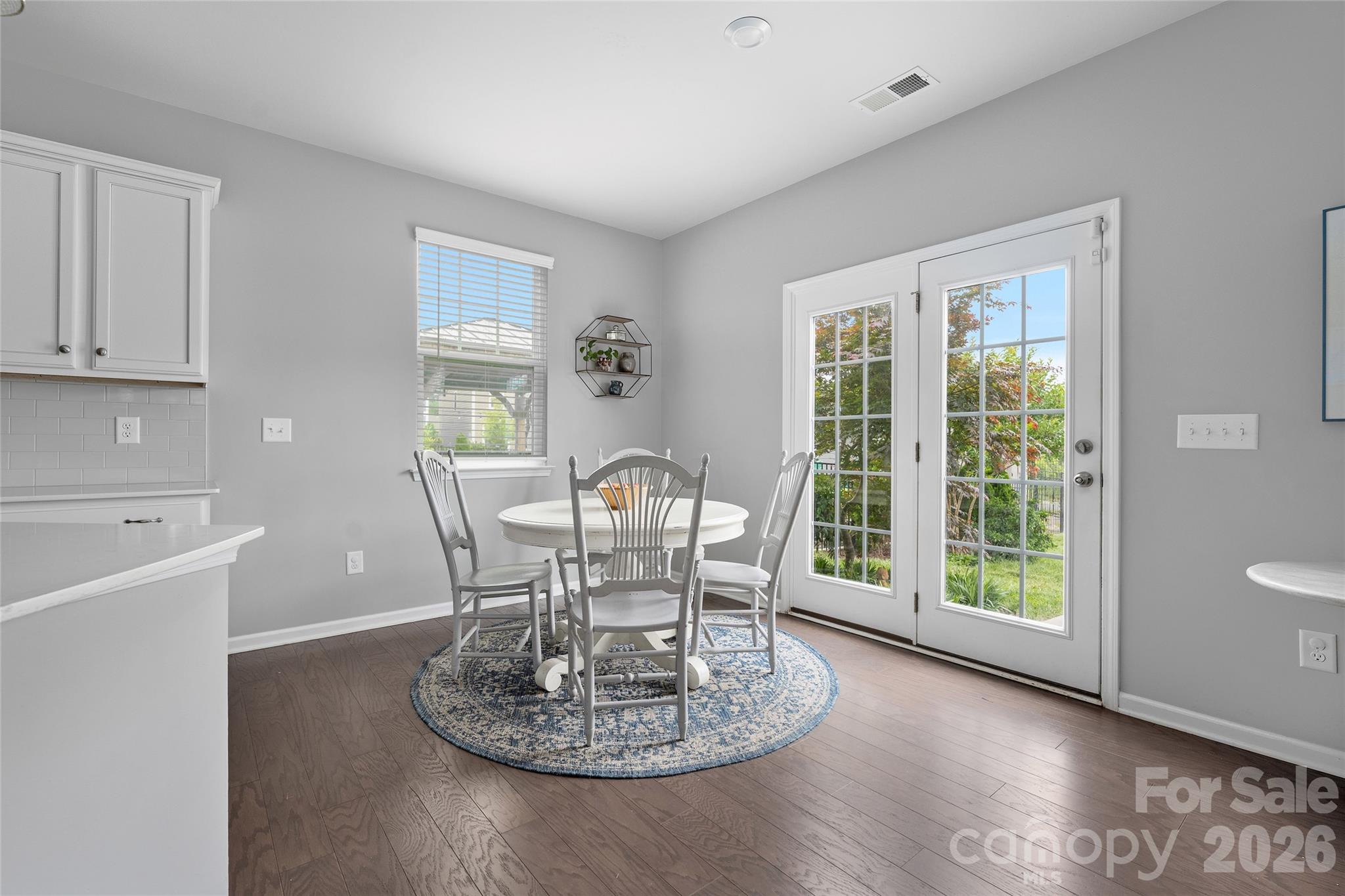 17219 Shearer Road Davidson, NC 28036 - Photo 8 of 34 a dining room with furniture a window and wooden floor
