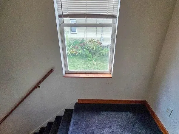 a view of a hallway with windows