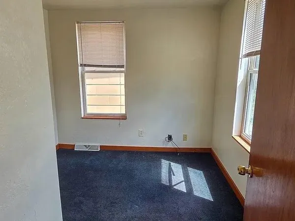 an empty room with windows