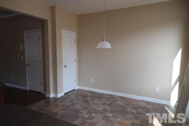 3518 Midway Island Court Raleigh, NC 27610 - Photo 5 of 10 en empty room with windows