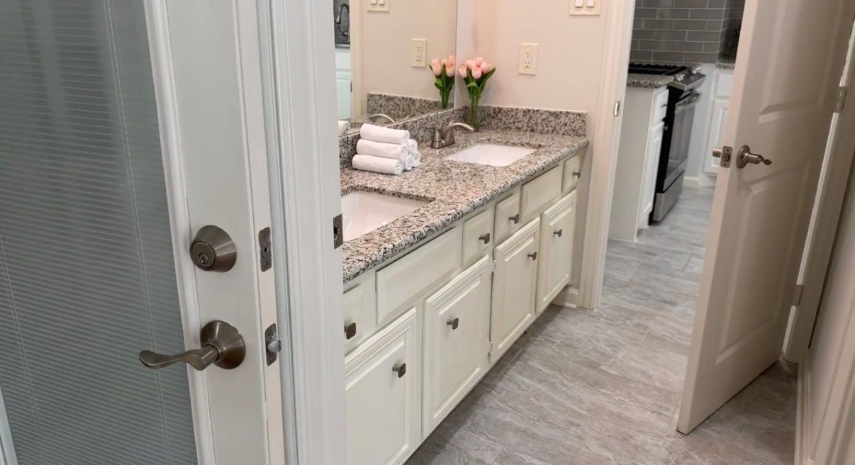 9626 Magnolia Ridge Drive Houston, TX 77070 - Photo 19 of 40 a bathroom with sink granite and mirror