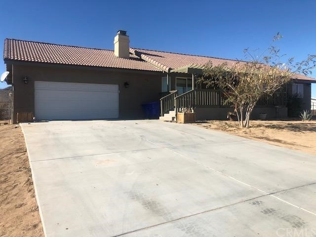 16250 Quantico Road Apple Valley, CA 92307 - Photo 1 of 1 a view of a house with a snow in front of it