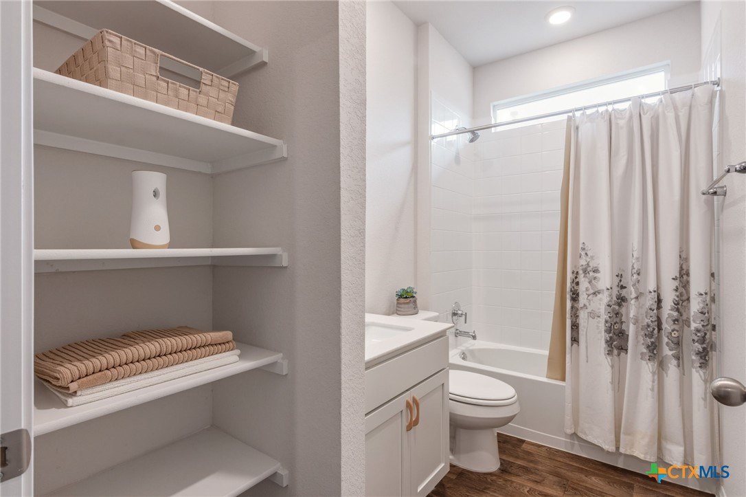 205 Charles Trail Georgetown, TX 78626 - Photo 18 of 38 a bathroom with a toilet a sink and a shower