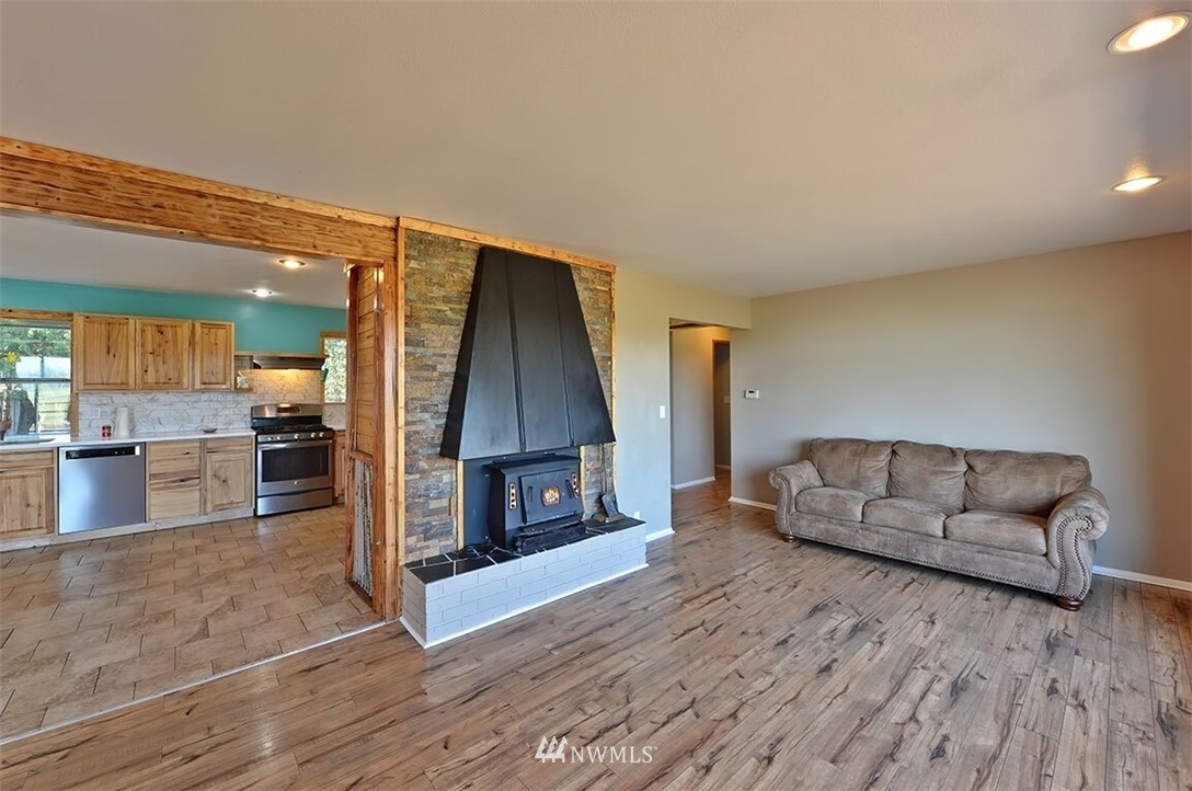 180 Beard Road Lynden, WA 98264 - Photo 12 of 27 a living room with furniture and a wooden floor