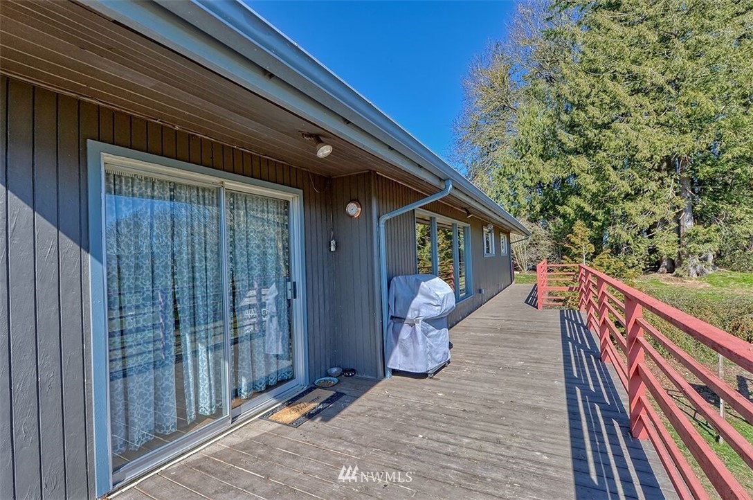 180 Beard Road Lynden, WA 98264 - Photo 24 of 27 a view of a house with backyard and deck