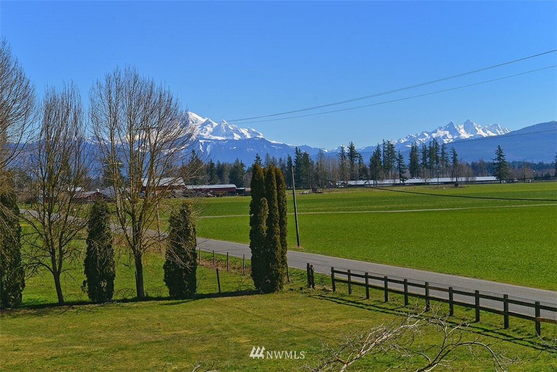 180 Beard Road Lynden, WA 98264 - Photo 5 of 27 a view of a golf course with a bench in the background