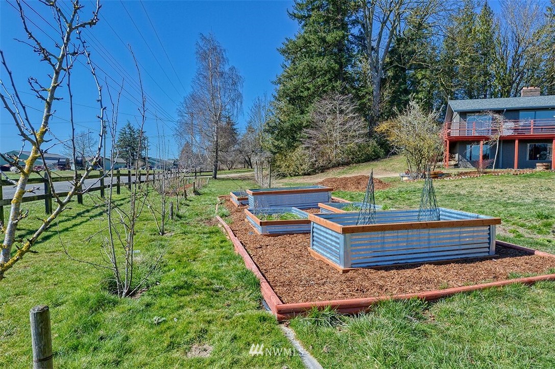 180 Beard Road Lynden, WA 98264 - Photo 8 of 27 a view of a wooden deck with a yard