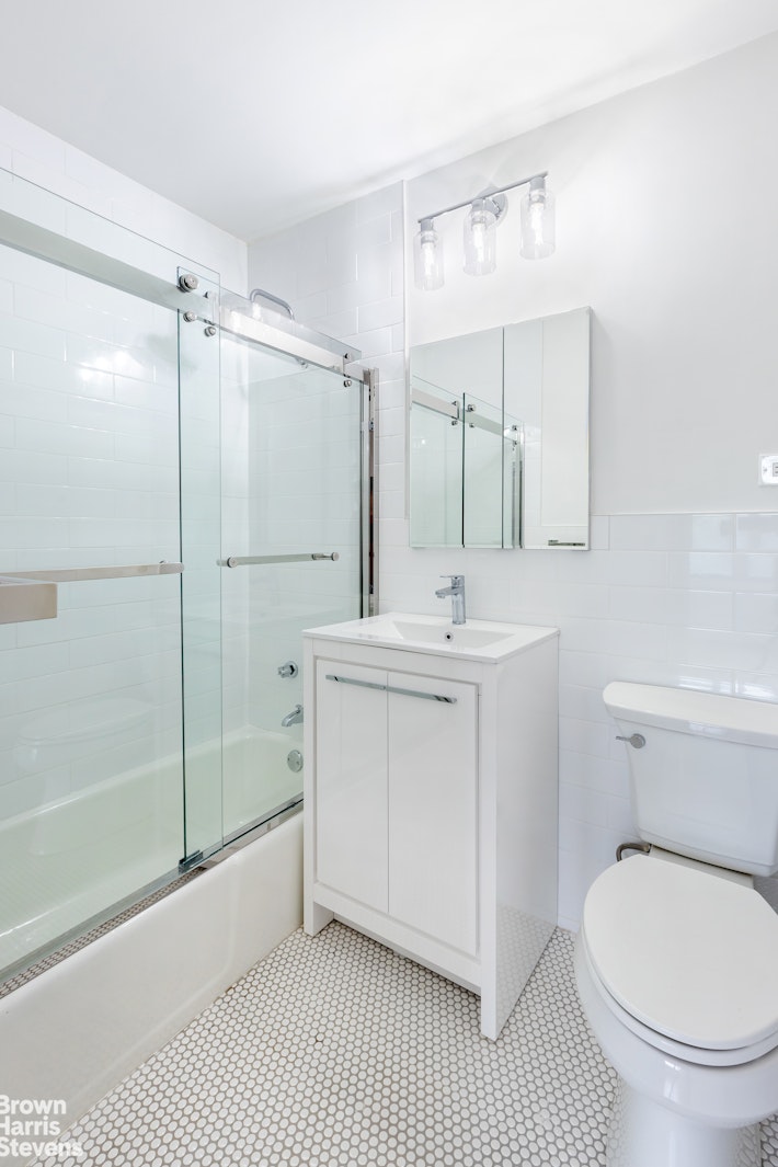 2500 Johnson Avenue, Unit 3B Bronx, NY 10463 - Photo 31 of 42 a bathroom with a sink a toilet and shower