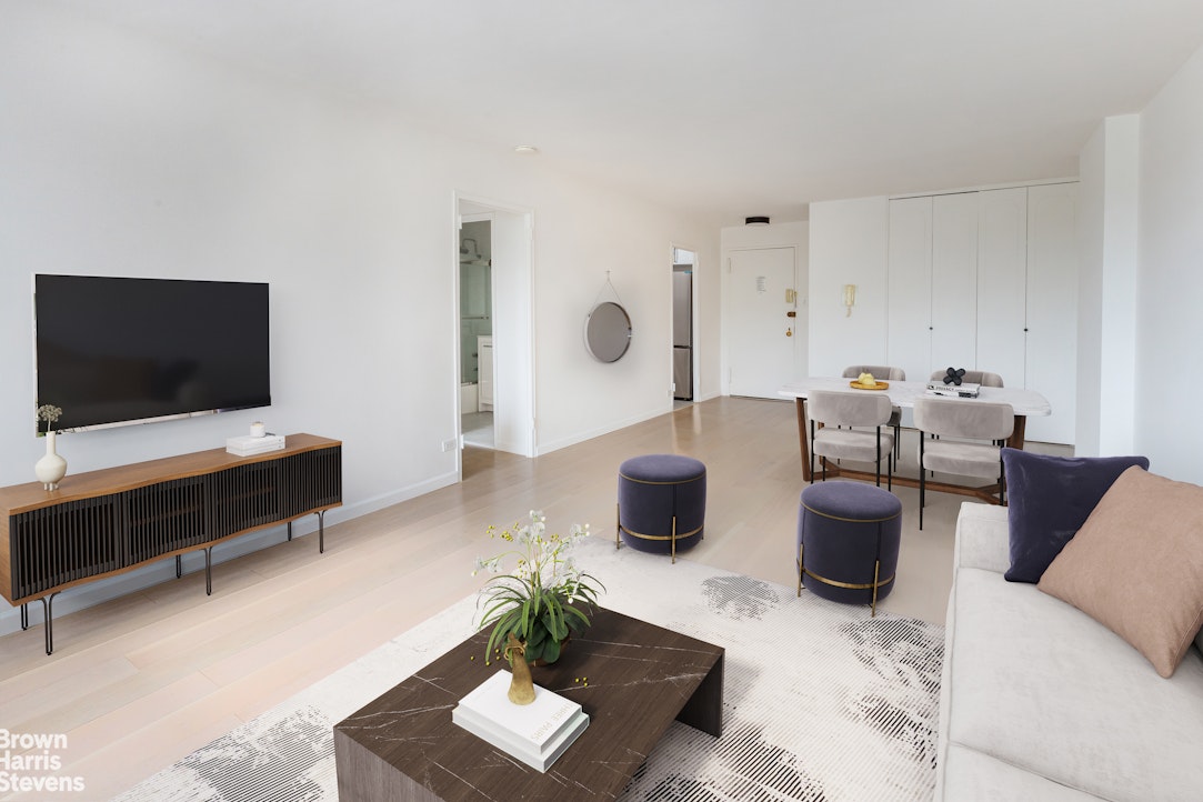 2500 Johnson Avenue, Unit 3B Bronx, NY 10463 - Photo 5 of 42 a living room with furniture and a flat screen tv