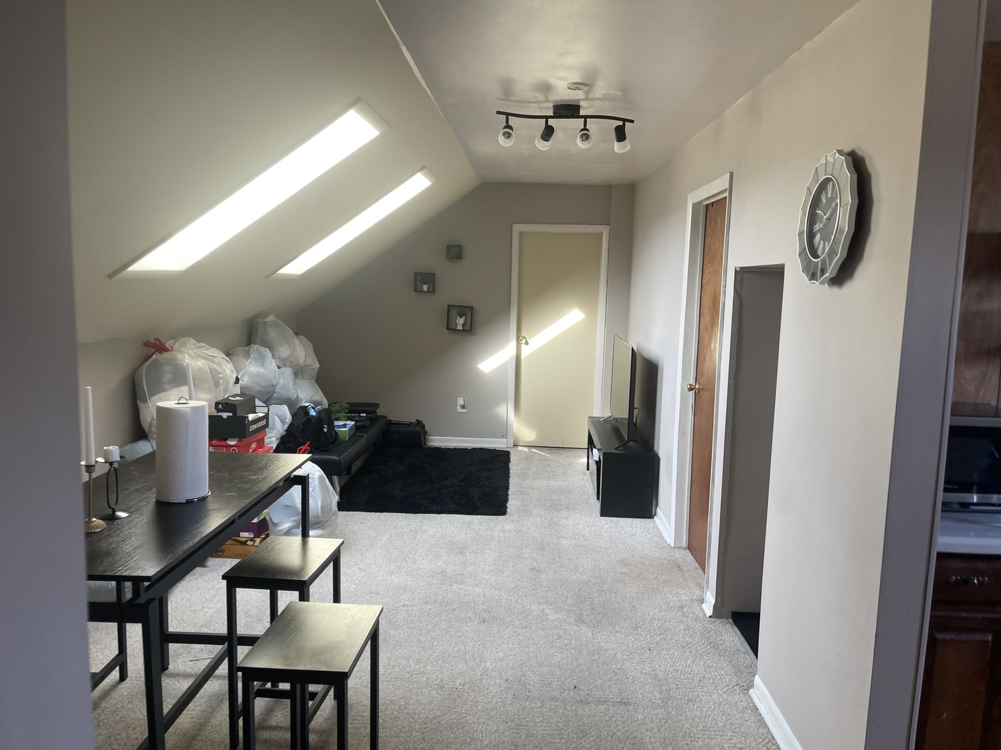 5631 West Cornelia Avenue Chicago, IL 60634 - Photo 14 of 28 a living room with furniture and a chandelier