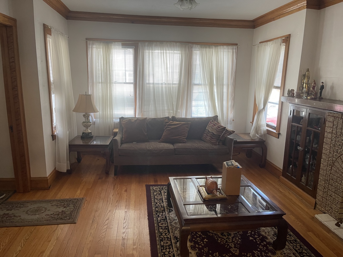 5631 West Cornelia Avenue Chicago, IL 60634 - Photo 2 of 28 a living room with furniture and a fireplace