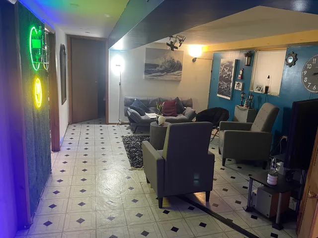 a living room with furniture and a fireplace