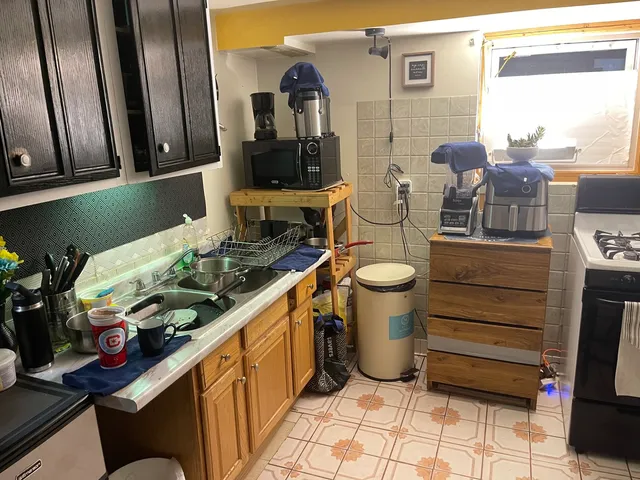 a view of a kitchen with appliances and cabinets