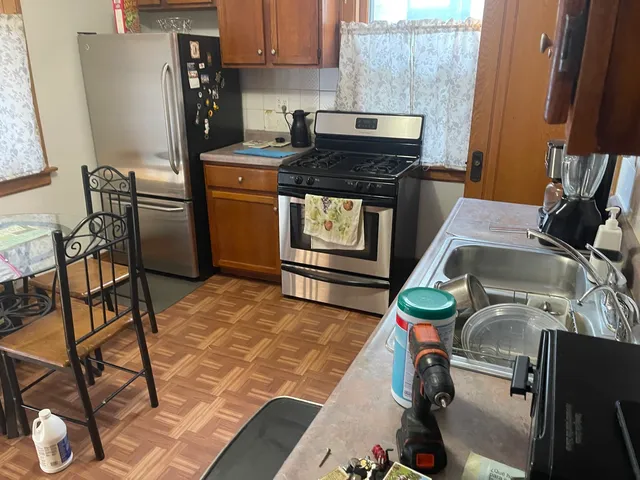 a kitchen with a stove and a refrigerator