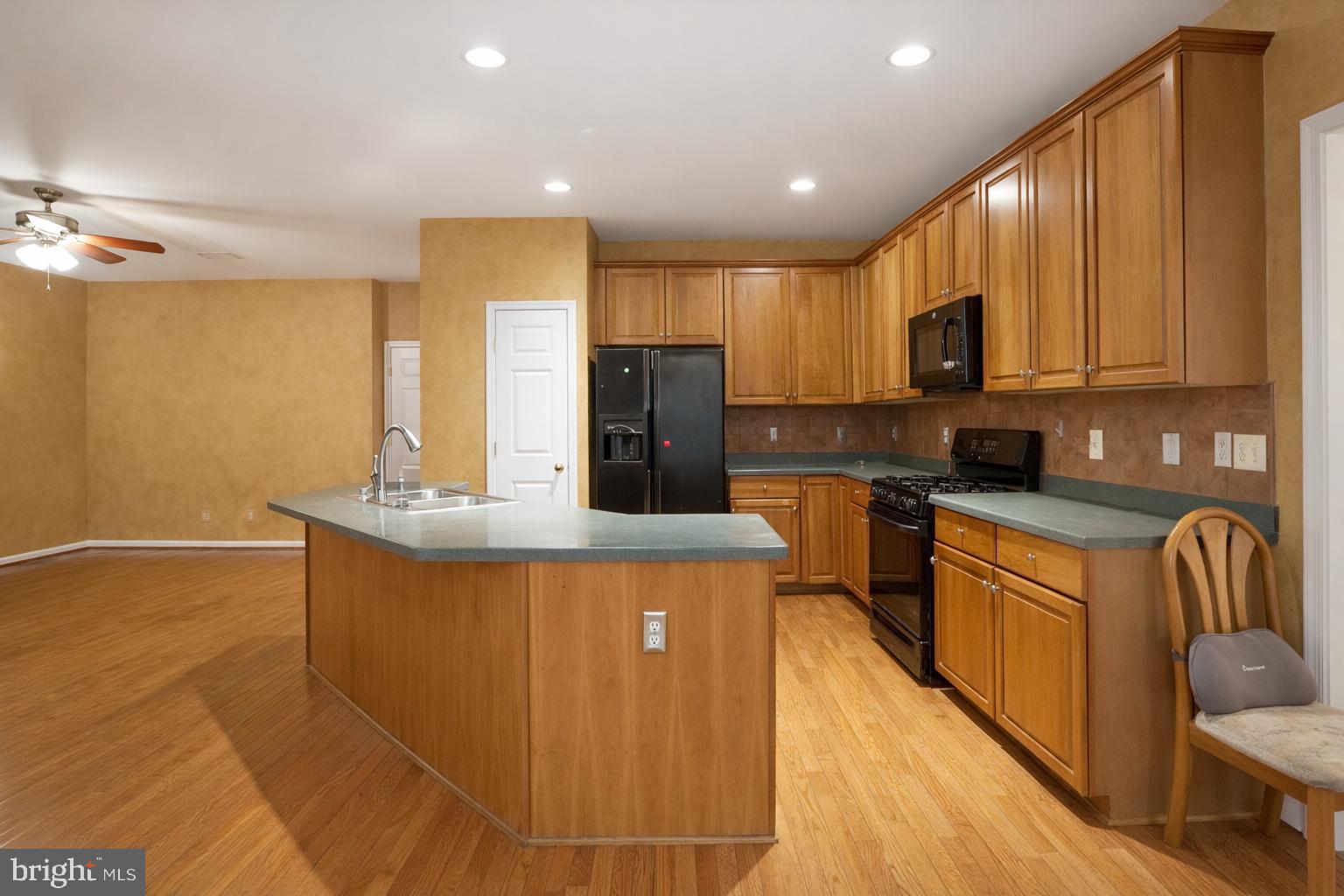 2448 Leyland Ridge Road Herndon, VA 20171 - Photo 11 of 62 Warm wood tones in a spacious kitchen.