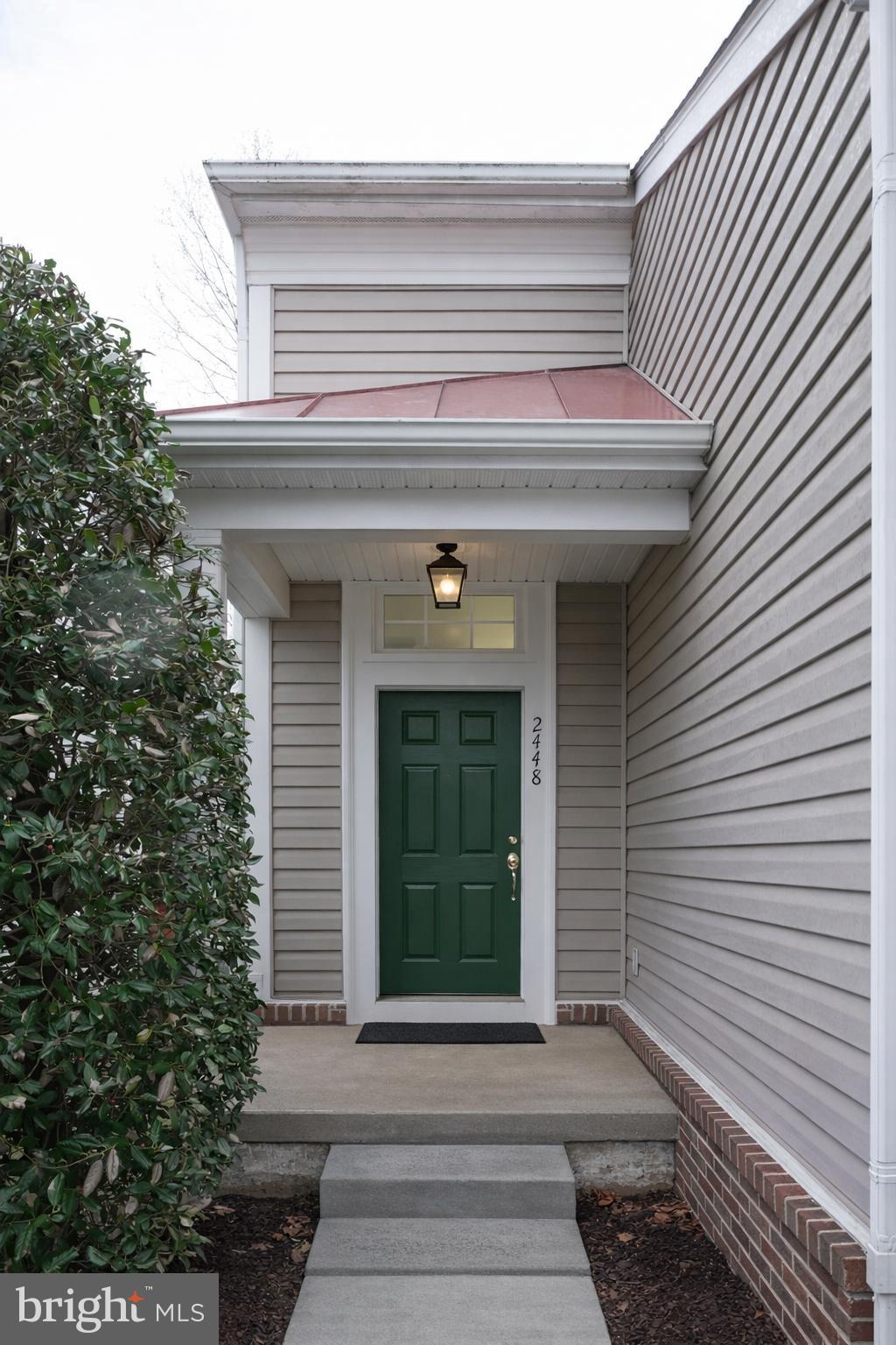2448 Leyland Ridge Road Herndon, VA 20171 - Photo 4 of 32 Charming entrance with a welcoming green door.