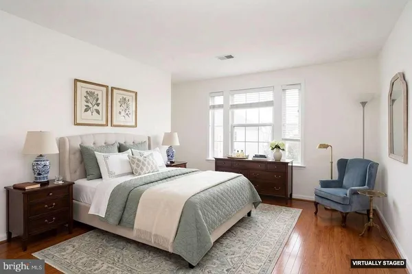 a bedroom with bed and a couch