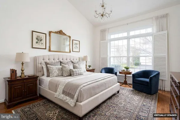 a bedroom with a bed and a couch