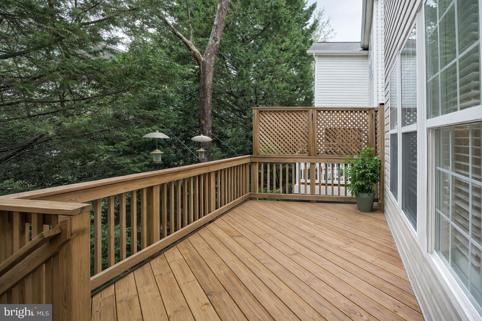 2448 Leyland Ridge Road Herndon, VA 20171 - Photo 55 of 62 Serene wooden deck surrounded by greenery.