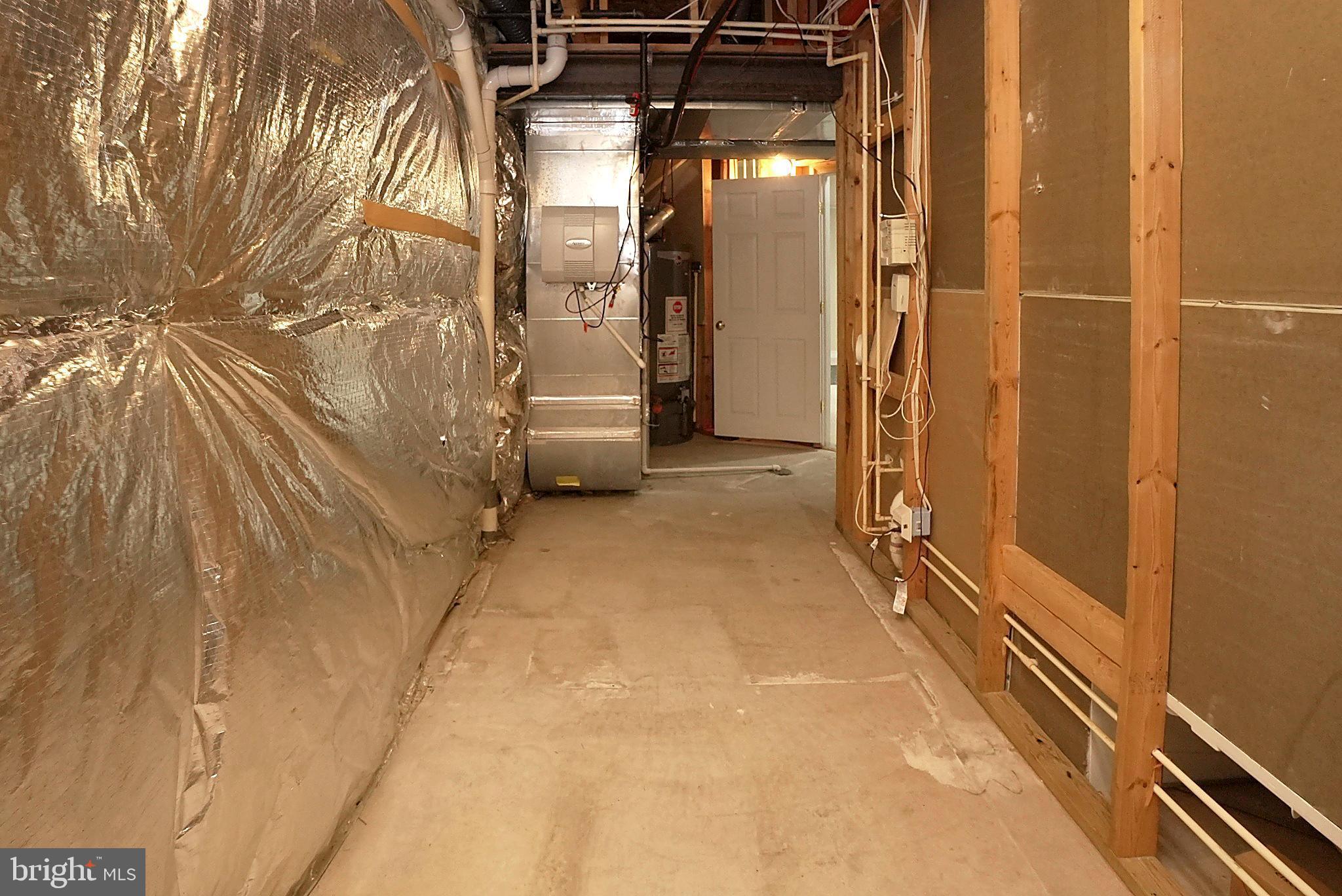 2448 Leyland Ridge Road Herndon, VA 20171 - Photo 57 of 62 Spacious basement corridor with utility access.