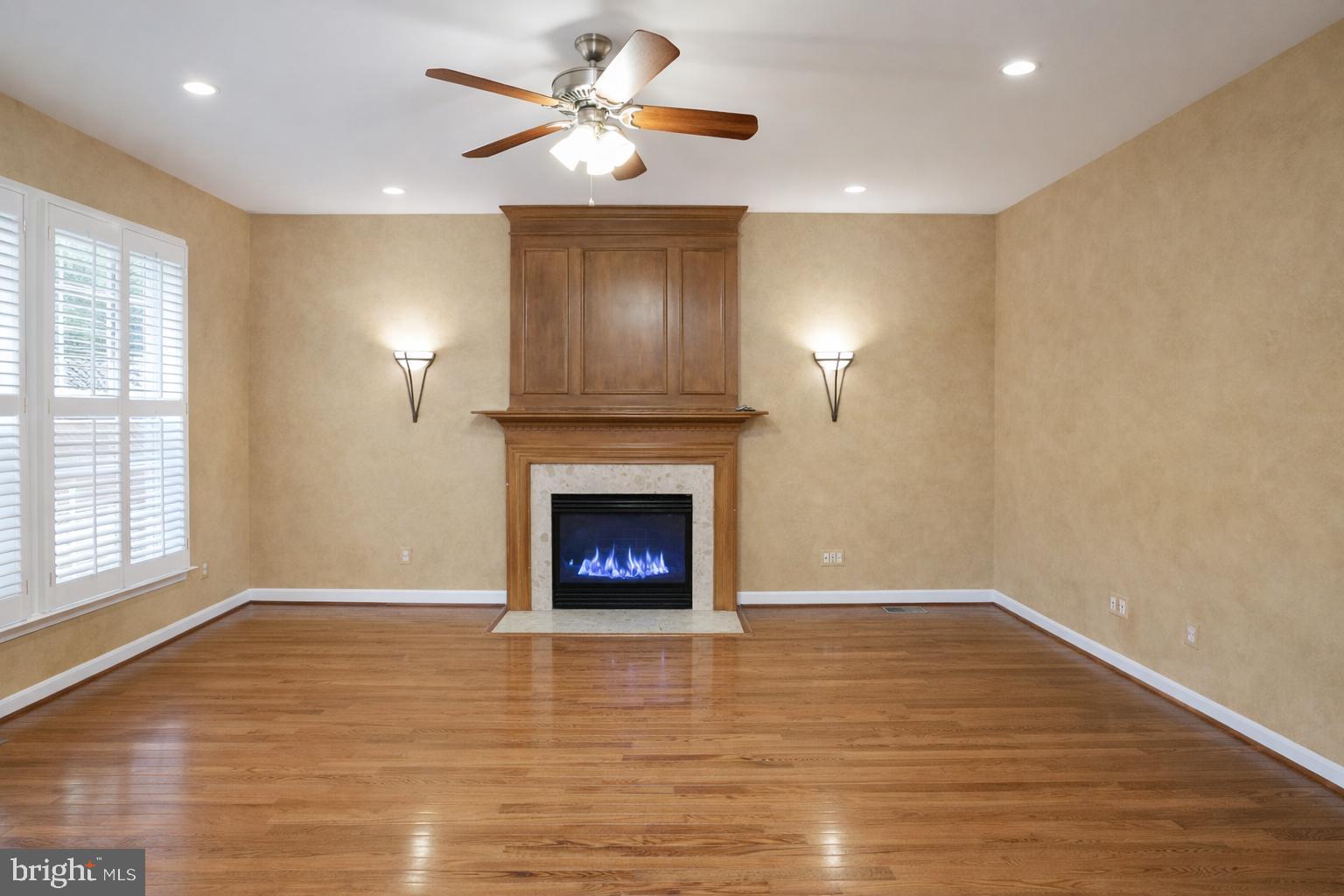 2448 Leyland Ridge Road Herndon, VA 20171 - Photo 6 of 62 Inviting space with elegant fireplace charm.