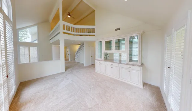 a view of a kitchen with a sink and cabinets