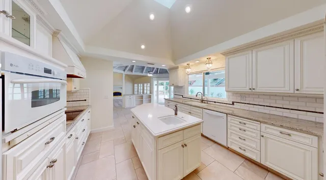 an empty room with a garage and a ceiling fan