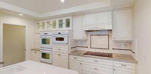 a bathroom with a sink double vanity and a mirror