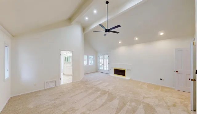 a front view of a house with a garden and patio