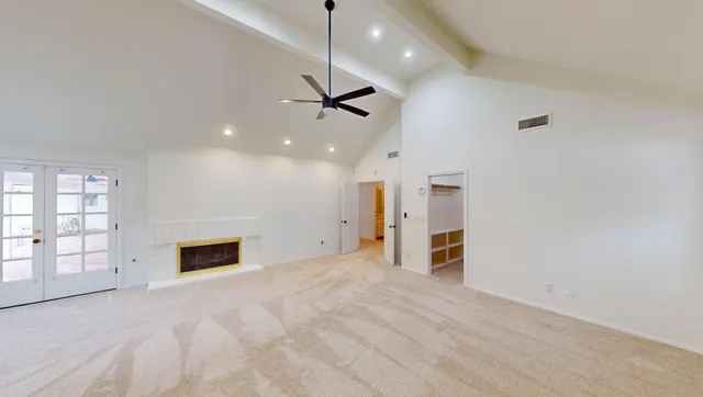 a view of a house with backyard sitting area and swimming pool