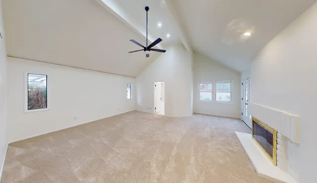 a close up of a vase of flowers sitting on a table