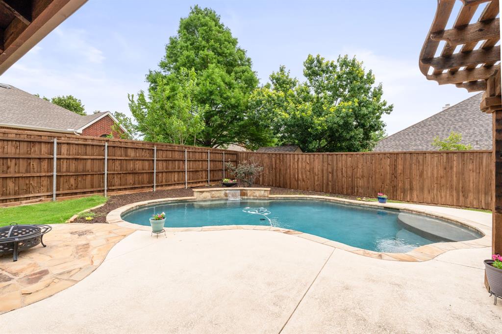 205 Crepe Myrtle Lane Murphy, TX 75094 - Photo 27 of 33 a view of a backyard with swimming pool