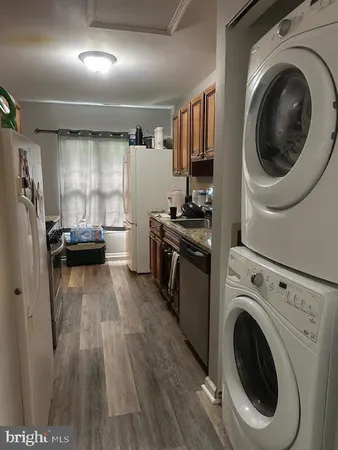 a view of a kitchen with washer and dryer