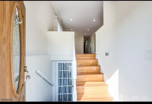 a view of staircase with white walls