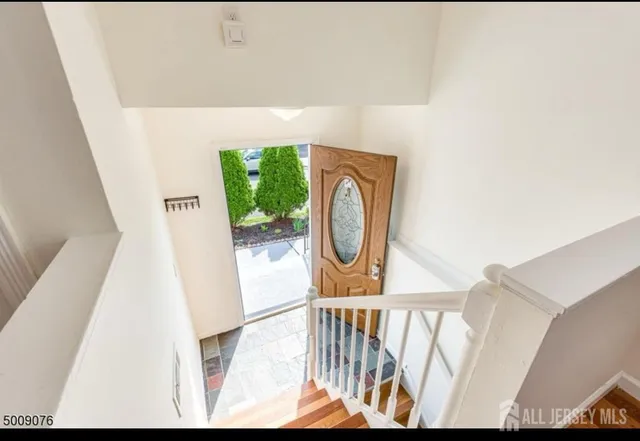 a view of entryway with wooden floor