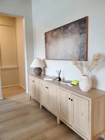 a spacious bathroom with a double vanity sink and a mirror